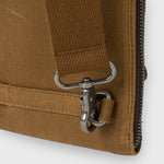Close-up of a brown bag with a metal clasp on a white background
