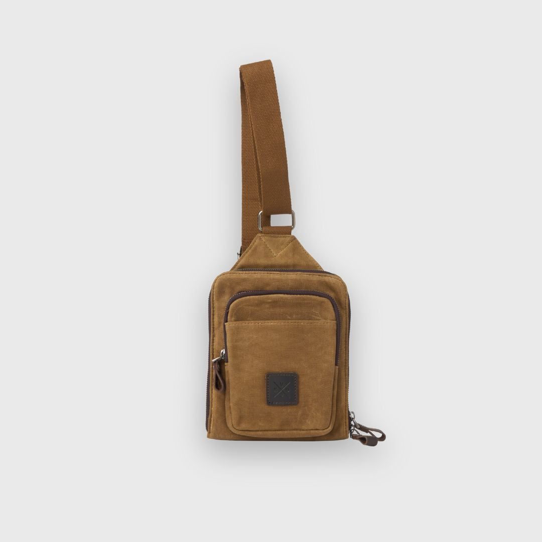 Brown suede shoulder bag on a light gray background