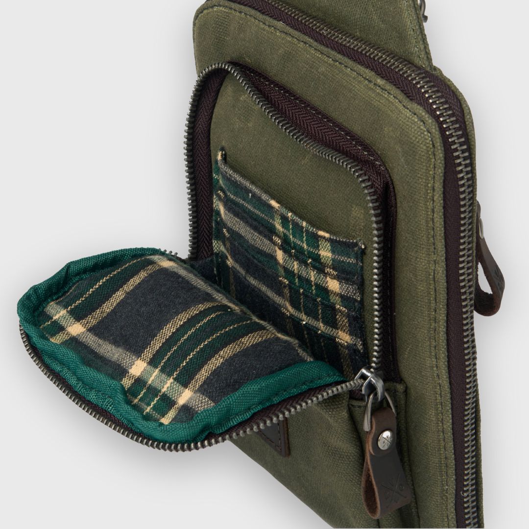 Green bag with plaid lining on a white background